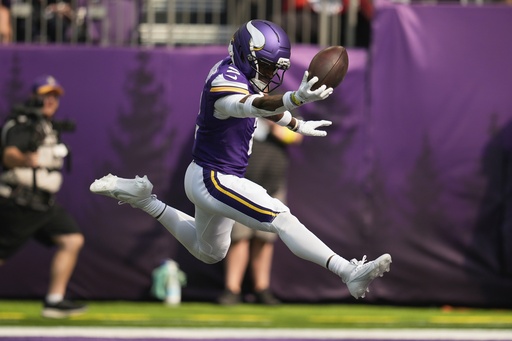 Minnesota Vikings cornerback Isaiah Rodgers celebrates as he recovered a fumble for a touchdown during the first half of an NFL football game against the Cincinnati Bengals, Sunday, Sept. 21, 2025, in Minneapolis. (AP Photo/Mike Stewart)