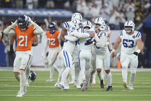 Indianapolis Colts place kicker Spencer Shrader (3) celebrates with teammates after kicking the game winning field goal during the second half an NFL football game against the Denver Broncos, Sunday, Sept. 14, 2025, in Indianapolis. (AP Photo/Michael Conroy)