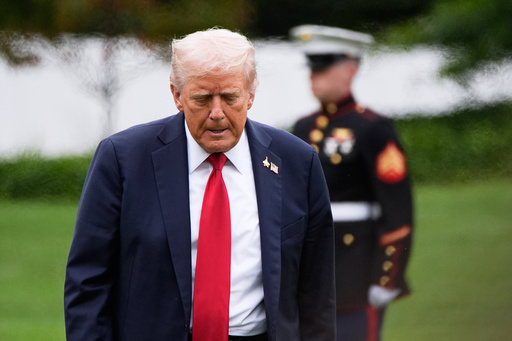 President Donald Trump walks from Marine One after arriving on the South Lawn of the White House, Tuesday, Sept. 30, 2025, in Washington. (AP Photo/Alex Brandon)