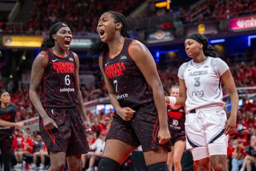 Indiana Fever forward Aliyah Boston (7) reacts after being fouled during the second half of Game 4 of a WNBA basketball playoff semifinals series against the Las Vegas Aces in Indianapolis, Sunday, Sept. 28, 2025. (AP Photo/Doug McSchooler)