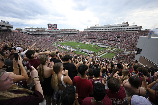 Florida State players run onto the field before the start of an NCAA college football game against Alabama, Saturday, Aug. 30, 2025, in Tallahassee, Fla. (AP Photo/Phelan M. Ebenhack)
