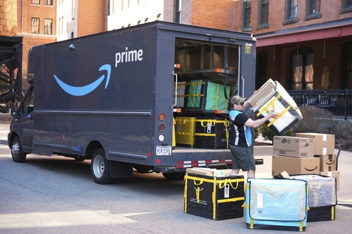 FILE - An Amazon Prime driver makes a delivery outside an apartment building in Pittsburgh, March 10, 2025. (AP Photo/Gene J. Puskar, File)