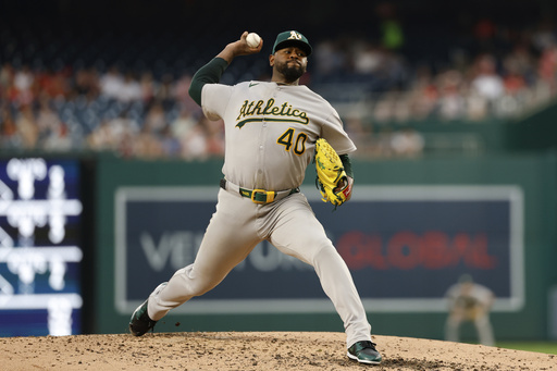 Athletics pitcher Luis Severino (40) throws during the third inning of a baseball game against the Washington Nationals in Washington, Tuesday, Aug. 5, 2025. (AP Photo/Terrance Williams)
