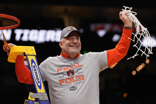 FILE - Auburn head coach Bruce Pearl celebrates with a net after the Elite Eight of the NCAA college basketball tournament against Michigan State, Sunday, March 30, 2025, in Atlanta. (AP Photo/Brynn Anderson, File)