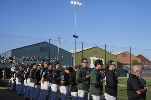 FILE - Oakland Ballers players stand during the national anthem before a Pioneer League baseball game against the Rocky Mountain Vibes in Oakland, Calif., July 10, 2025. (AP Photo/Jeff Chiu, File)