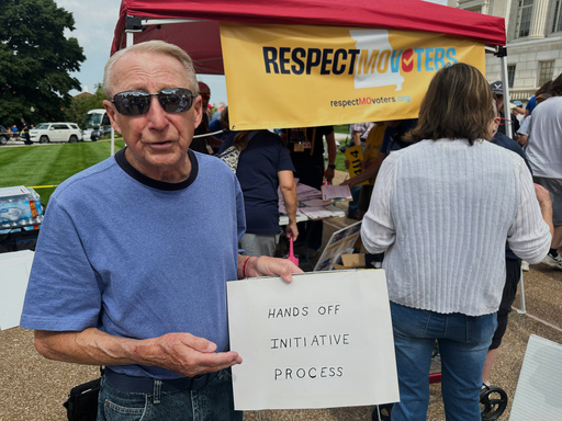 John Billman, of Columbia, Mo., holds a sign explaining his opposition to a state legislative proposal that would make it harder for voters to approve citizen-initiated constitutional amendments while rallying at the state Capitol in Jefferson City, on Wednesday, Sept. 10, 2025. (AP Photo/David A. Lieb)