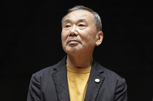 FILE - Japanese novelist Haruki Murakami sits for photos during a news conference at the Waseda University in Tokyo on Sept. 22, 2021. (AP Photo/Eugene Hoshiko, File)