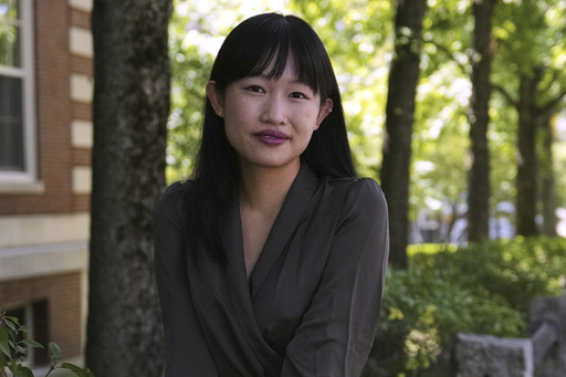 FILE - Author R.F. Kuang poses for a portrait near Harvard University in Cambridge, Mass., on Monday, July 28, 2025. (AP Photo/Charles Krupa, File)
