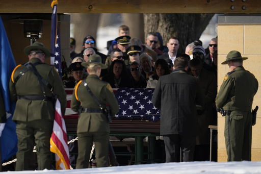 FILE - U.S. Border Patrol agent David Maland is recognized with military honors before his burial at Fort Snelling National Cemetery in Minneapolis on Feb. 22, 2025. (AP Photo/Abbie Parr, File)