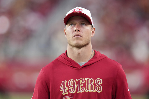 San Francisco 49ers running back Christian McCaffrey walks on the sideline during a preseason NFL football game against the Denver Broncos Saturday, Aug. 9, 2025, in Santa Clara, Calif. (AP Photo/Godofredo A. Vásquez)