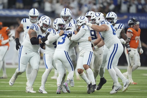 Indianapolis Colts place kicker Spencer Shrader (3) celebrates with teammates after kicking the game winning field goal during the second half an NFL football game against the Denver Broncos, Sunday, Sept. 14, 2025, in Indianapolis. (AP Photo/Michael Conroy)