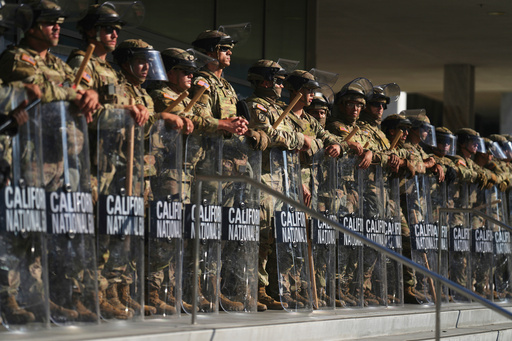 FILE - California National Guard are positioned at the Federal Building, June 10, 2025, in downtown Los Angeles. (AP Photo/Eric Thayer, File)