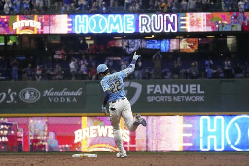 Milwaukee Brewers' Christian Yelich hits a two-run home run during the seventh inning of a baseball game against the St. Louis Cardinals Friday, Sept. 12, 2025, in Milwaukee. (AP Photo/Morry Gash)