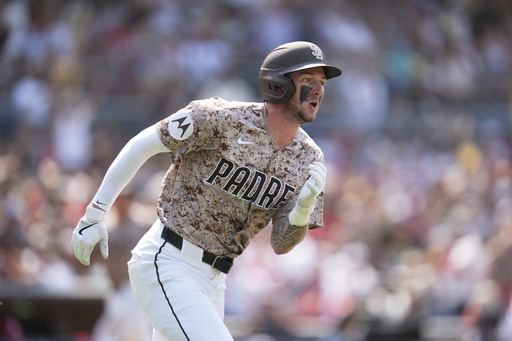 San Diego Padres' Jackson Merrill watches his three-RBI triple during the seventh inning of a baseball game against the St. Louis Cardinals Sunday, Aug. 3, 2025, in San Diego. (AP Photo/Gregory Bull)