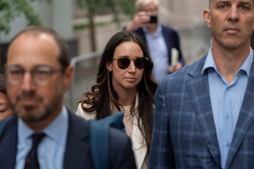 Charlie Javice, center, exits Manhattan federal court, Monday, Sept. 29, 2025, in New York. (AP Photo/Yuki Iwamura)