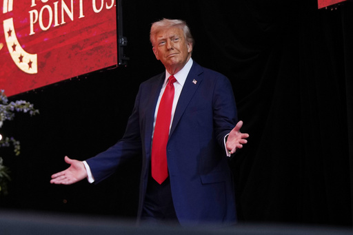 President Donald Trump arrives to speak at a memorial for conservative activist Charlie Kirk, Sunday, Sept. 21, 2025, at State Farm Stadium in Glendale, Ariz. (AP Photo/Julia Demaree Nikhinson)