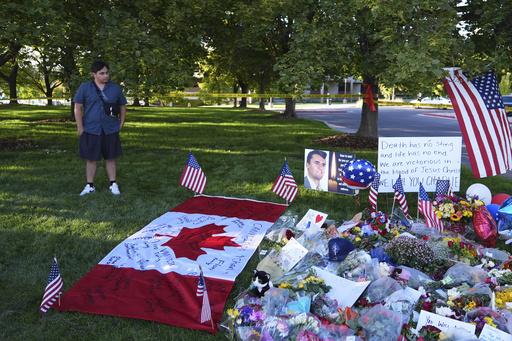 Utah Valley University student Alec Vera stands near a memorial for Charlie Kirk on Friday, Sept. 12, 2025, in Orem, Utah. (AP Photo/Lindsey Wasson)