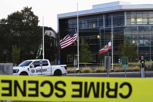 Crime scene tape surrounds Utah Valley University after Turning Point USA CEO and co-founder Charlie Kirk was shot and killed , Saturday, Sept. 13, 2025, in Orem, Utah. (AP Photo/Lindsey Wasson)