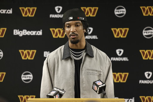 Washington Commanders quarterback Jayden Daniels speaks during a news conference following an NFL football game against the Green Bay Packers Thursday, Sept. 11, 2025, in Green Bay, Wis. (AP Photo/Matt Ludtke)