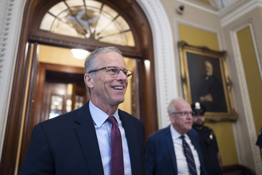 Senate Majority Leader John Thune, R-S.D., is met by reporters as he walks to his office while Congress works on a government funding solution, at the Capitol in Washington, Thursday, Sept. 18, 2025. (AP Photo/J. Scott Applewhite)