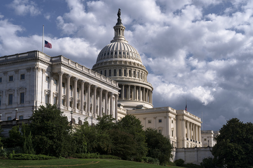 The west front of the Capitol is seen in Washington, Thursday, Sept. 11, 2025, where the flags have been lowered to half-staff after the assassination of conservative activist Charlie Kirk. (AP Photo/J. Scott Applewhite)