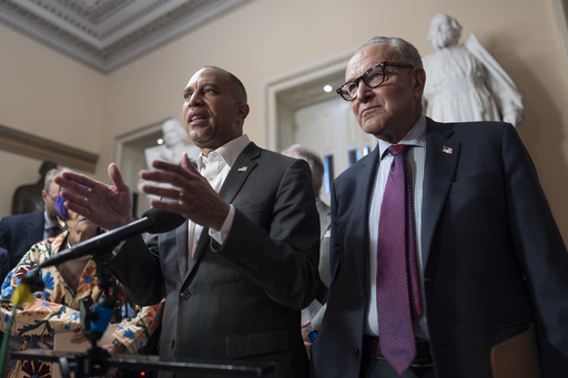 House Democratic Leader Hakeem Jeffries, left, and Senate Democratic Leader Chuck Schumer, both of New York, tell reporters that they are united as the Sept. 30 funding deadline approaches, at the Capitol in Washington, Thursday, Sept. 11, 2025. (AP Photo/J. Scott Applewhite)