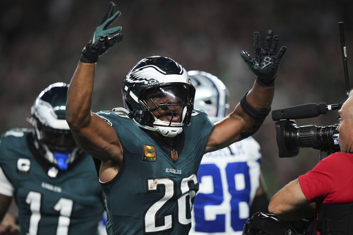 Philadelphia Eagles' Saquon Barkley celebrates after scoring a touchdown in the first half of an NFL football game against the Dallas Cowboys Thursday, Sept. 4, 2025, in Philadelphia. (AP Photo/Matt Slocum)