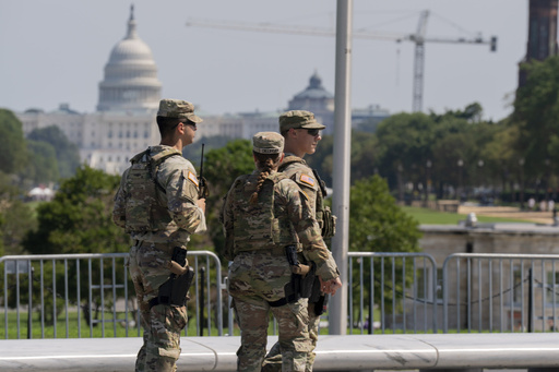 Members of the Ohio National Guard patrol the National Mall Sunday, Sept. 14, 2025, in Washington. (AP Photo/Jose Luis Magana)