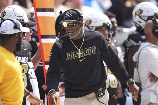 Colorado head coach Deion Sanders directs players in the first half of an NCAA college football game against Delaware Saturday, Sept. 6, 2025, in Boulder, Colo. (AP Photo/David Zalubowski)