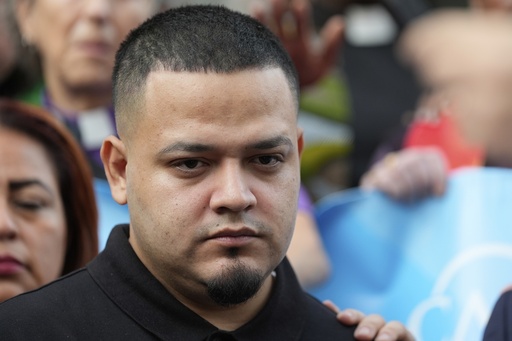 FILE - Kilmar Abrego Garcia joins supporters in a protest rally outside the Immigration and Customs Enforcement field office in Baltimore, Aug. 25, 2025. (AP Photo/Stephanie Scarbrough, File)