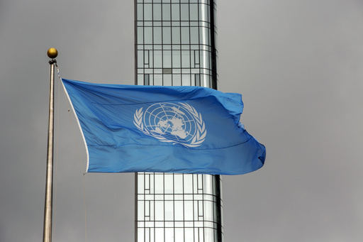 FILE - The UN flag flies on a stormy day at the United Nations during the United Nations General Assembly on Sept. 22, 2022. (AP Photo/Ted Shaffrey, File)