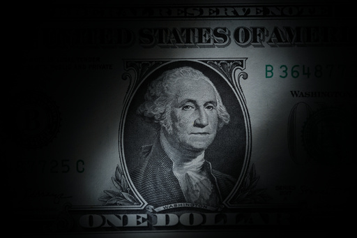 FILE - The likeness of George Washington is seen on a U.S. one dollar bill, March 13, 2023, in Marple Township, Pa. (AP Photo/Matt Slocum, File)