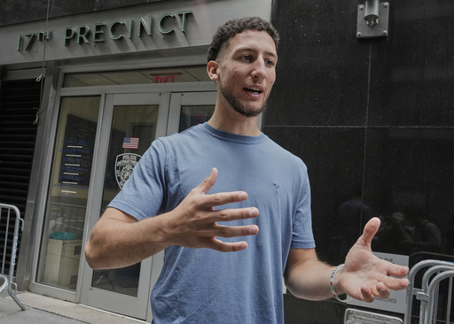 Yasin El Sammak is interviewed outside the New York City Police Department's 17th Precinct, Wednesday, Aug. 27, 2025. (AP Photo/Richard Drew)