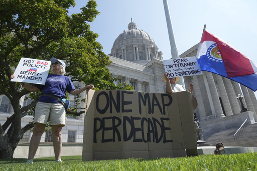 Robin Rothove, left, and Paula Smith, right, demonstrate outside the Missouri Capitol as lawmakers prepare to conduct a committee hearing inside to consider redrawing the state's U.S. House districts, Thursday, Sept. 4, 2025, in Jefferson City, Mo. (AP Photo/Jeff Roberson)