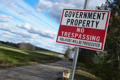 FILE - A sign warns against trespassing on government property at the site of a planned Rivian electric truck plant March 7, 2024, in Rutledge, Ga. (AP Photo/John Bazemore, File)