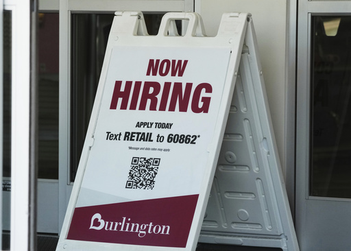 "Now Hiring" sign is displayed at a retail store in Schaumburg, Ill., Thursday, Sept. 18, 2025. (AP Photo/Nam Y. Huh)