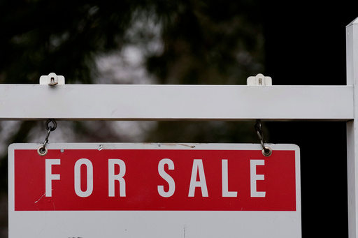 FILE - A for sale sign stands outside a residence in Wheeling, Ill., Dec. 16, 2024. (AP Photo/Nam Y. Huh, File)