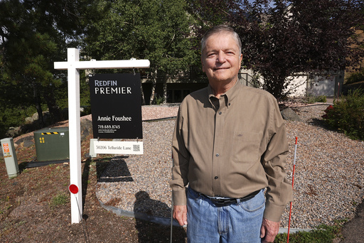 Doug McCormick is shown outside his four-bedroom home that has been up for sale for almost two months Tuesday, Aug. 26, 2025, near Evergreen, Colo. (AP Photo/David Zalubowski)