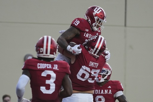 Indiana tight end Holden Staes (19) celebrates a touchdown catch with offensive lineman Carter Smith during the first half of an NCAA college football game against Indiana State , Friday, Sept. 12, 2025, in Bloomington, Ind. (AP Photo/Darron Cummings)