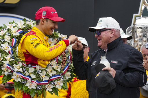 FILE - Car owner Chip Ganassi touches the winner ring as he and Alex Palou, of Spain, celebrate after winning the Indianapolis 500 auto race at Indianapolis Motor Speedway in Indianapolis, Sunday, May 25, 2025. (AP Photo/Michael Conroy, File)