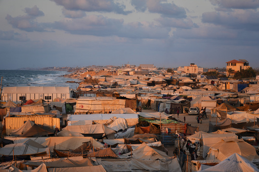 A tent camp for displaced Palestinians stretches along the Muwasi, an area that Israel has designated as a safe zone, in Khan Younis southern Gaza Strip, Thursday, Sept. 25, 2025. (AP Photo/Jehad Alshrafi)