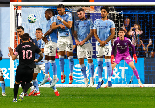 New York City FC defend a direct kick by Inter Miami forward Lionel Messi (10) during the first half of a MLS soccer game, Wednesday, Sept. 24, 2025, in New York. (AP Photo/Noah K. Murray)