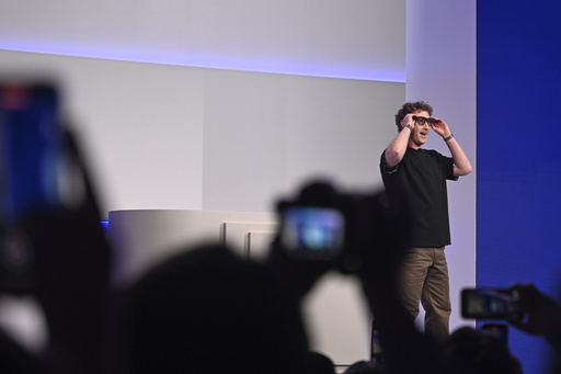 Meta CEO Mark Zuckerberg wears artificial intelligence-powered smart glasses as he speaks during the company's Connect developer conference Wednesday, Sept. 17, 2025, in Menlo Park, Calif. (AP Photo/Nic Coury)