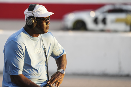 Team owner Michael Jordan looks on during a NASCAR Cup Series auto race at Darlington Raceway, Sunday, Aug. 31, 2025, in Darlington, S.C. (AP Photo/Matt Kelley)