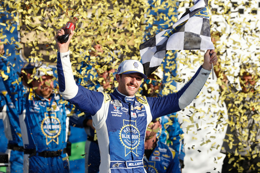 Chase Elliott celebrates in Victory Lane after winning a NASCAR Cup Series auto race at Kansas Speedway in Kansas City, Kan., Sunday, Sept. 28, 2025. (AP Photo/Colin E. Braley)