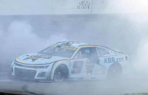 Chase Elliott does a burnout after winning a NASCAR Cup Series auto race at Kansas Speedway in Kansas City, Kan., Sunday, Sept. 28, 2025. (AP Photo/Colin E. Braley)