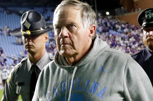 North Carolina head coach Bill Belichick walks off the field after the team fell to TCU in his debut as the univerity's new head coach at the end of an NCAA college football game Monday, Sept. 1, 2025, in Chapel Hill, N.C. (AP Photo/Chris Seward)