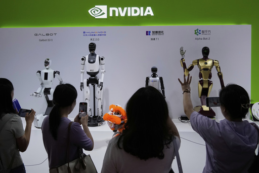FILE - Visitors give commands to a robot at Nvidia's booth during the 3rd China International Supply Chain Expo at the China International Exhibition Center, in Beijing, July 18, 2025. (AP Photo/Mahesh Kumar A., File)