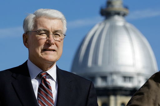 FILE - Former Illinois Gov. Jim Edgar speaks during a campaign rally outside the state Capitol on Nov. 3, 2014, in Springfield, Ill. (AP Photo/Seth Perlman, File)