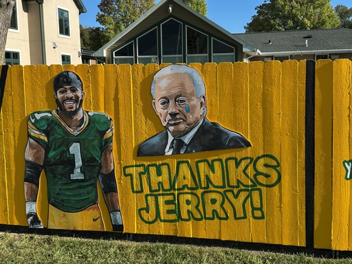 A sign outside a home across the street from Lambeau Field thanks Dallas Cowboy's owner Jerry Jones for trading Micah Parsons to the Green Bay Packers in Green Bay, Wis., on Thursday, Sept. 25, 2025. (AP Photo/Steve Megargee)